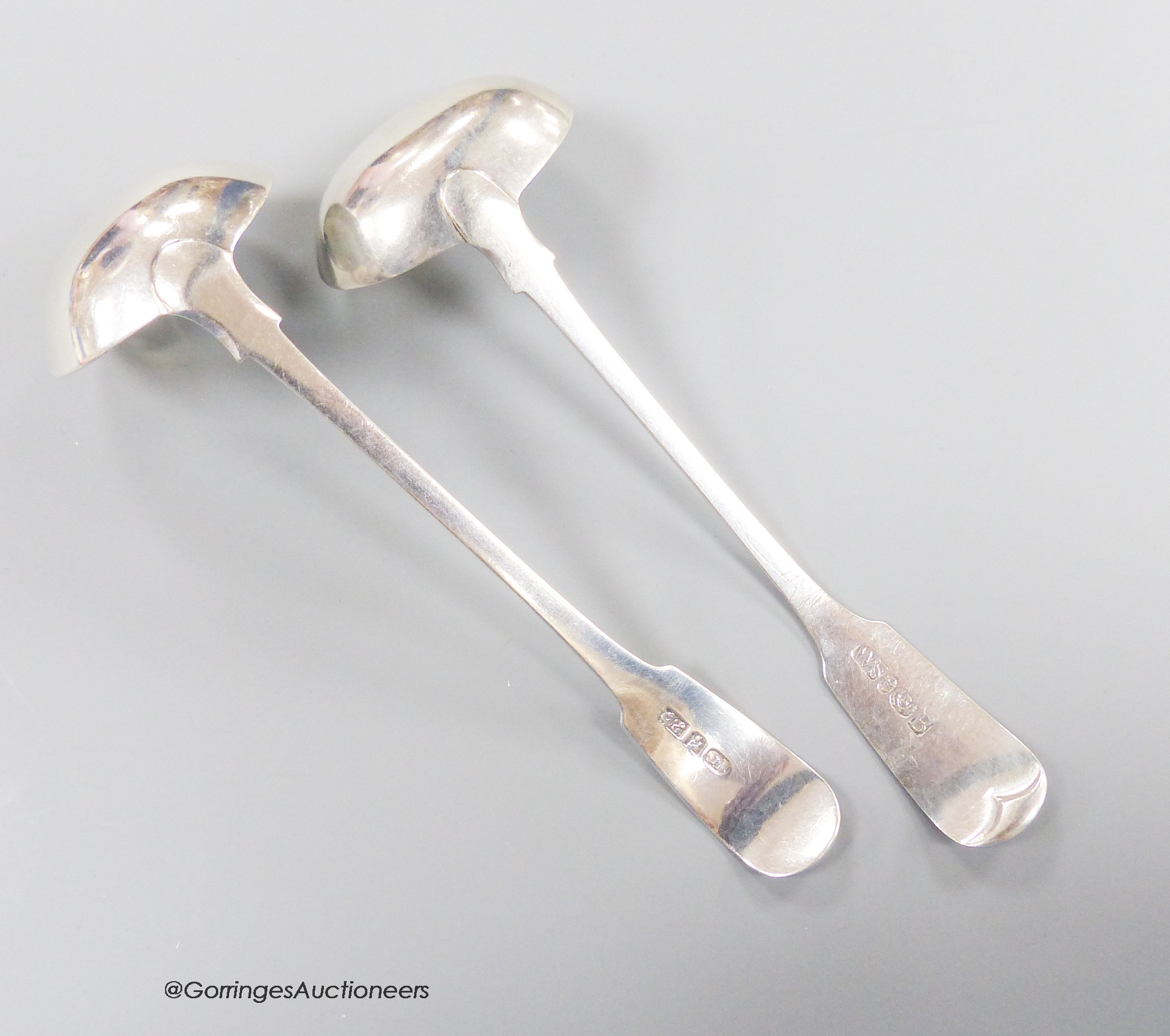 Two 19th century Scottish provincial silver fiddle pattern toddy ladles, George Elder, Banff, c.1825 and William Simpson, Banff, c.1840, longest 16.2cm, 62 grams.